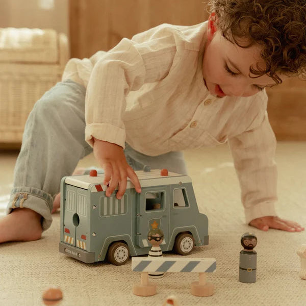 Child playing with Little Dutch police van and figures