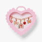 Set of colorful charms in a pink heart-shaped box