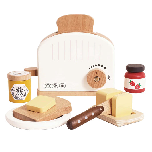 Children's toy toaster set with wooden slices, butter, and jam on a white background