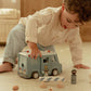 Child playing with Little Dutch police van and figures